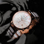 "Shiny" watch with nacre face and ceramic band, featuring a sleek, elegant design.