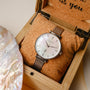 "Piccolo" watch featuring a nacre dial and silver mesh band, in an elegant wooden box.