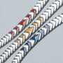 "Command" bracelet featuring a sleek, silver chevron design with vivid jade accents.