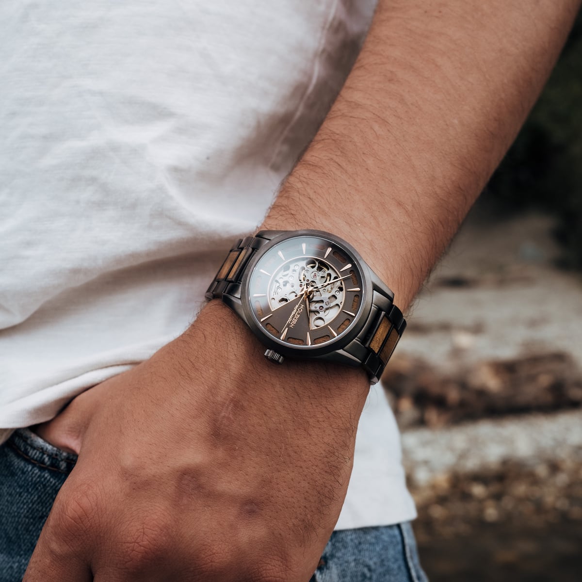 "Tenoumer" wristwatch, featuring a koa wood and dark grey color scheme.