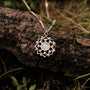 "Composition Gem Necklace": Elegant necklace featuring a moonstone pendant with a rose gold finish in a natural setting.