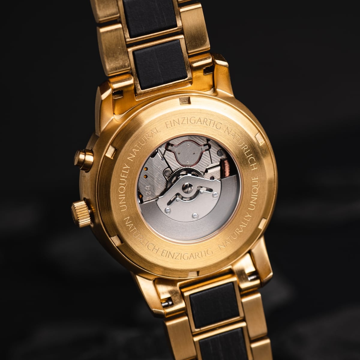"Cyclonic" watch in gold finish, showcasing an intricate mechanical design and elegant styling.