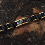 "Adagio" bracelet featuring marble and gold accents with a sleek and elegant design.