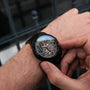 "Adrenin, a stylish wristwatch, featuring a blend of cat's eye and walnut materials."