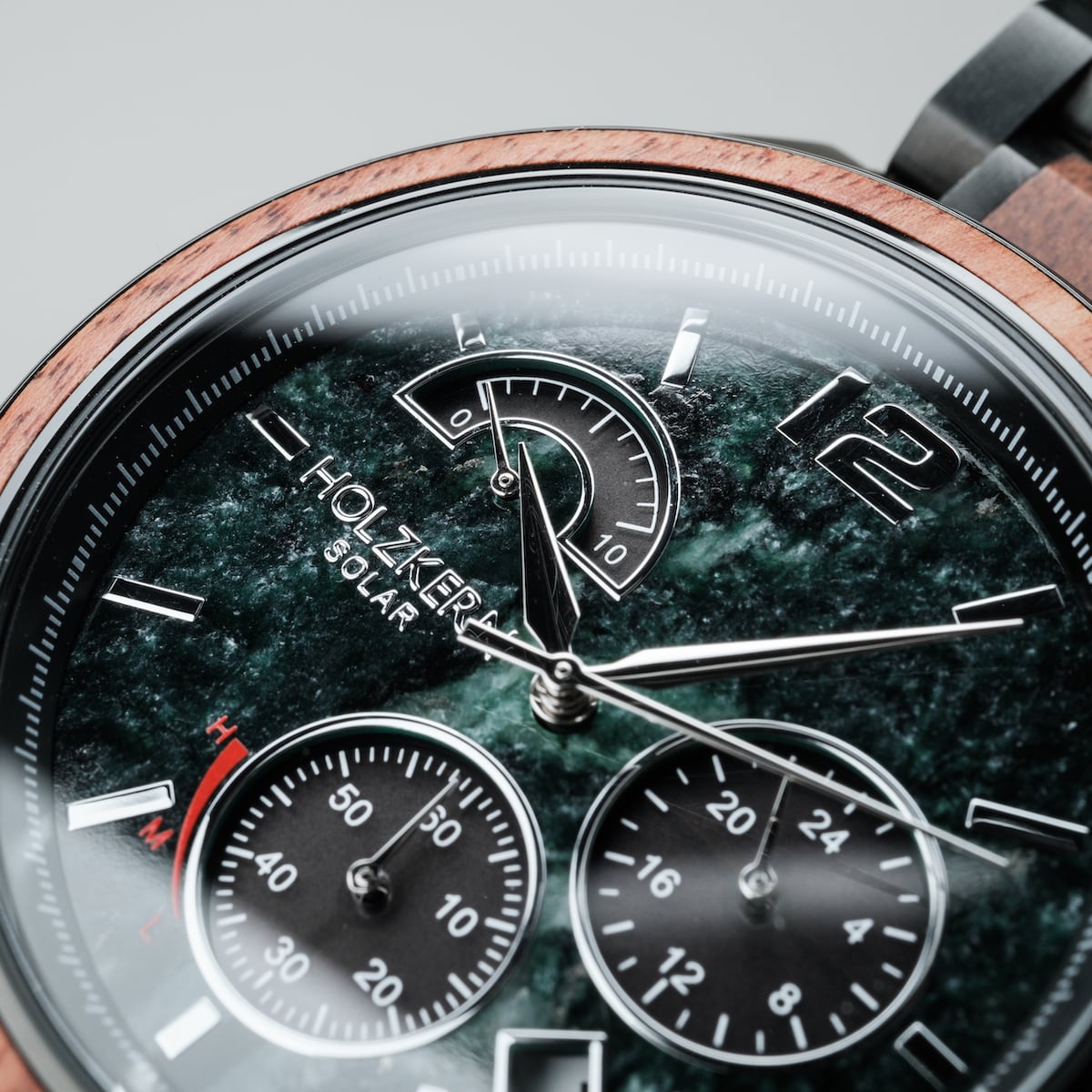 "Scattered" watch featuring a marble and koa wood style with detailed dials and a modern aesthetic.