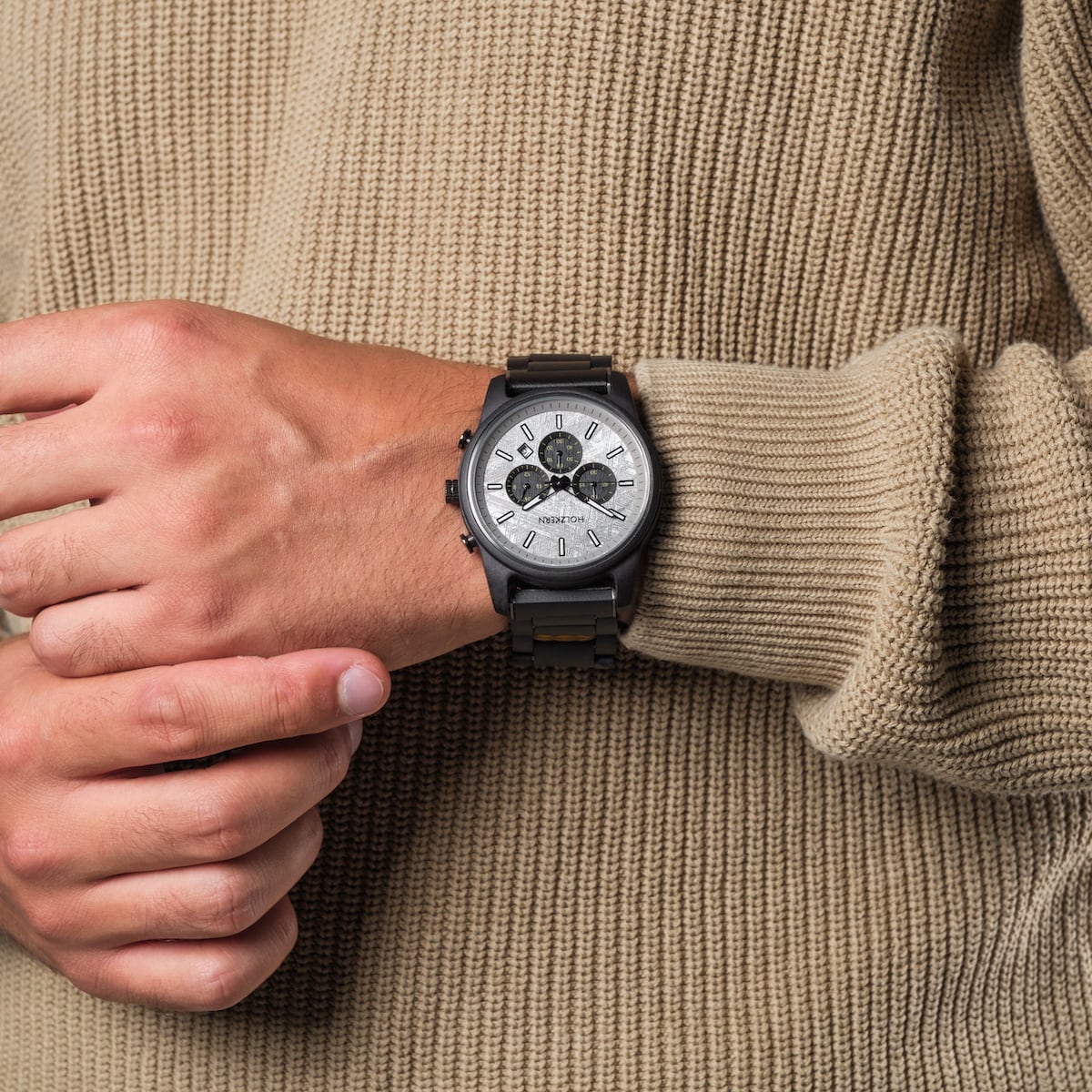 "Northwall" watch with a maple and rock grey design on a person's wrist.