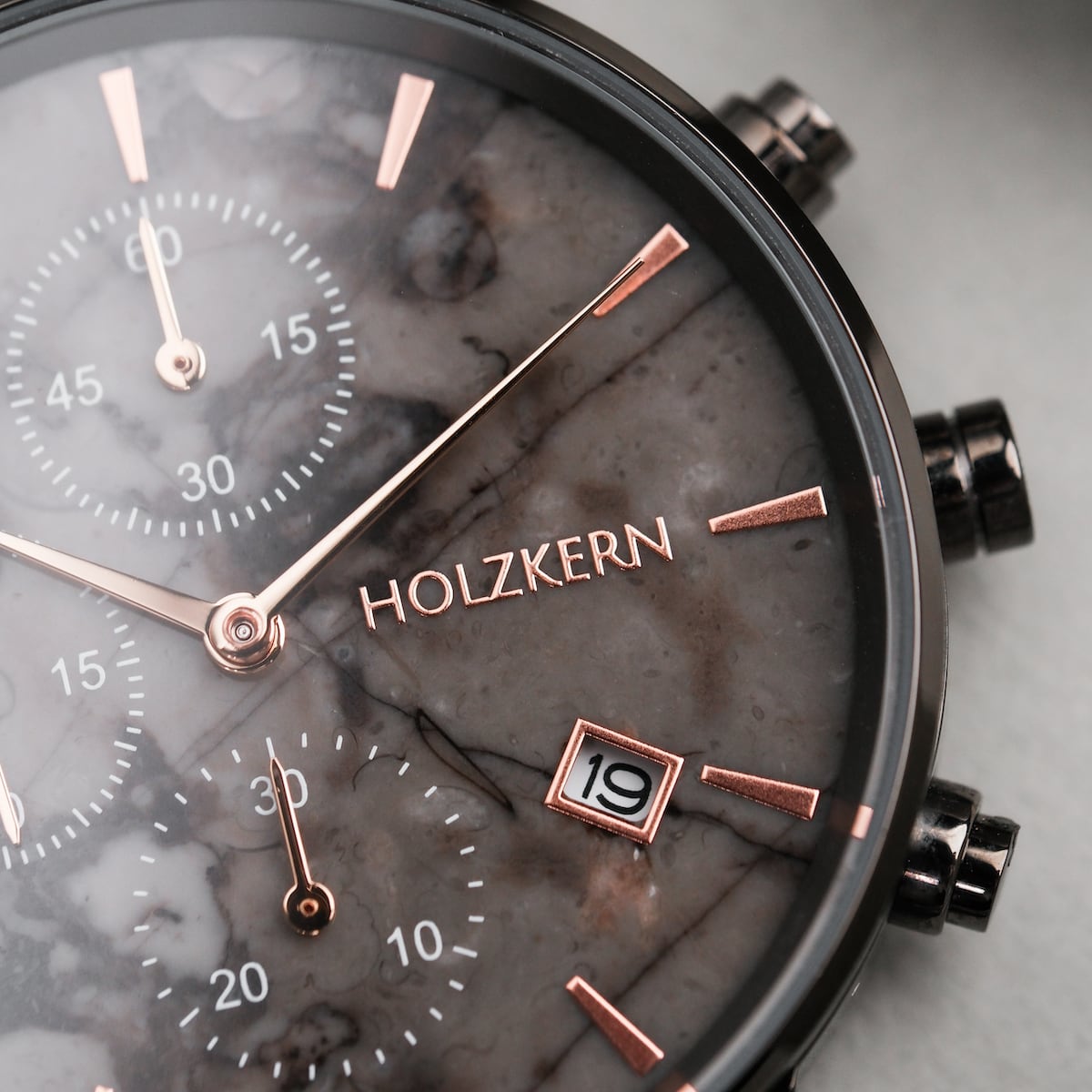 "Breezy watch featuring a marble-style face with ceramic accents and sleek rose gold hands."