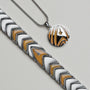 "Command", a jade and silver necklace, featuring geometric and star designs.