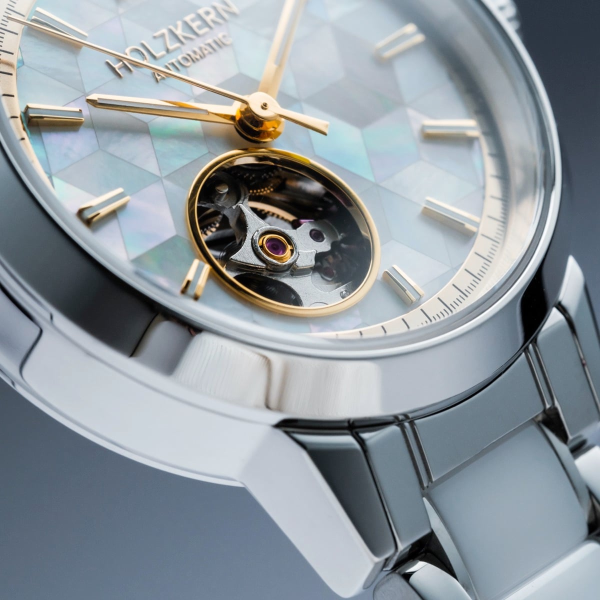 "Cristals", a luxury wristwatch featuring a nacre and ceramic face with a metallic strap, combining elegance and precision.
