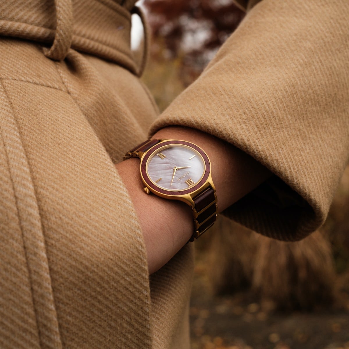 "Mauritius" elegant wristwatch featuring amaranth and nacre materials with a sophisticated design.