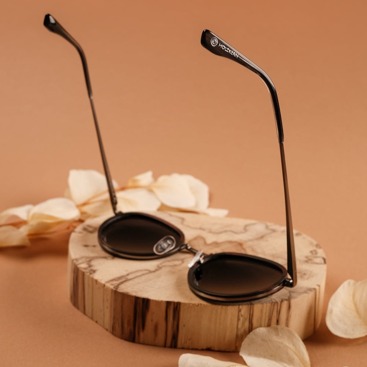 "The Radiant S" sunglasses with Leadwood frame and dark grey lenses, featuring an elegant and natural style.