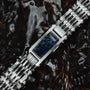"Adagio" watch featuring a stylish blue marble face and sleek silver band.