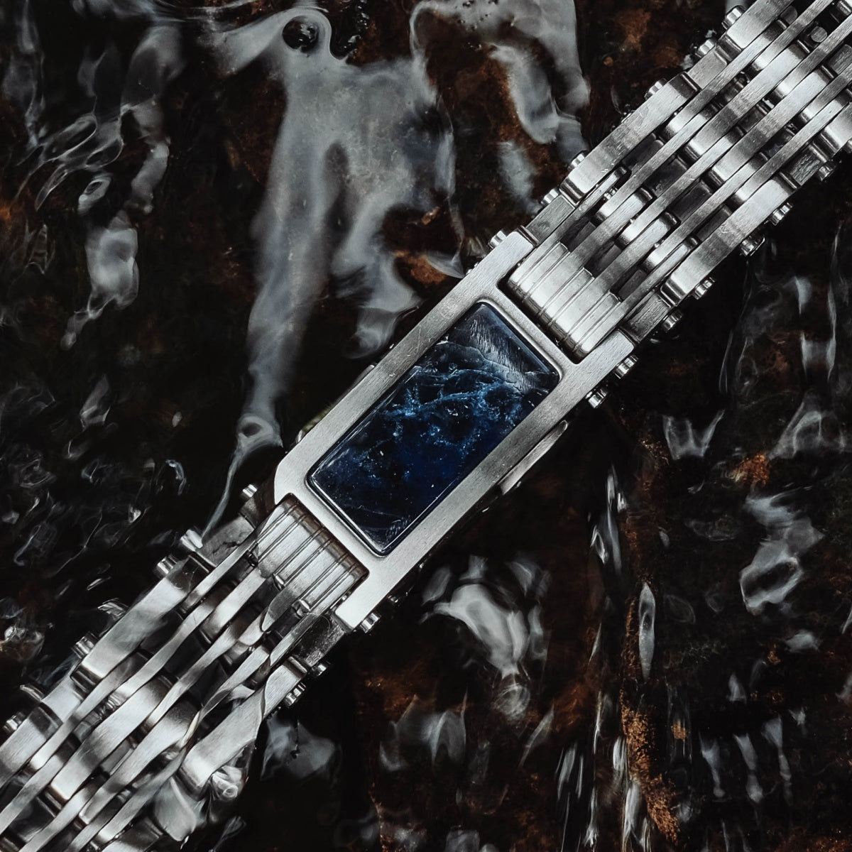 "Adagio" watch featuring a stylish blue marble face and sleek silver band.