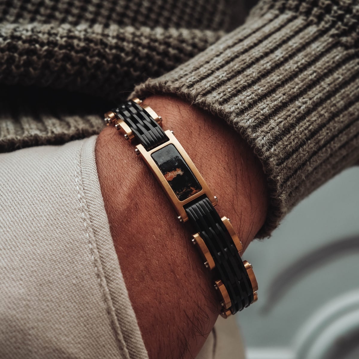 "Adagio", a marble and gold bracelet with a sleek, modern design.