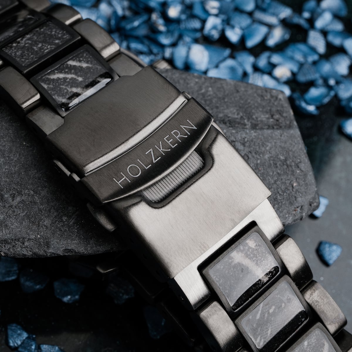 "Pacemaker watch with marble accents and sleek metallic design."