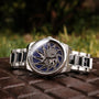 "Spikes watch with intricate design, featuring Lapis Lazuli and Maple accents on a silver metal bracelet."