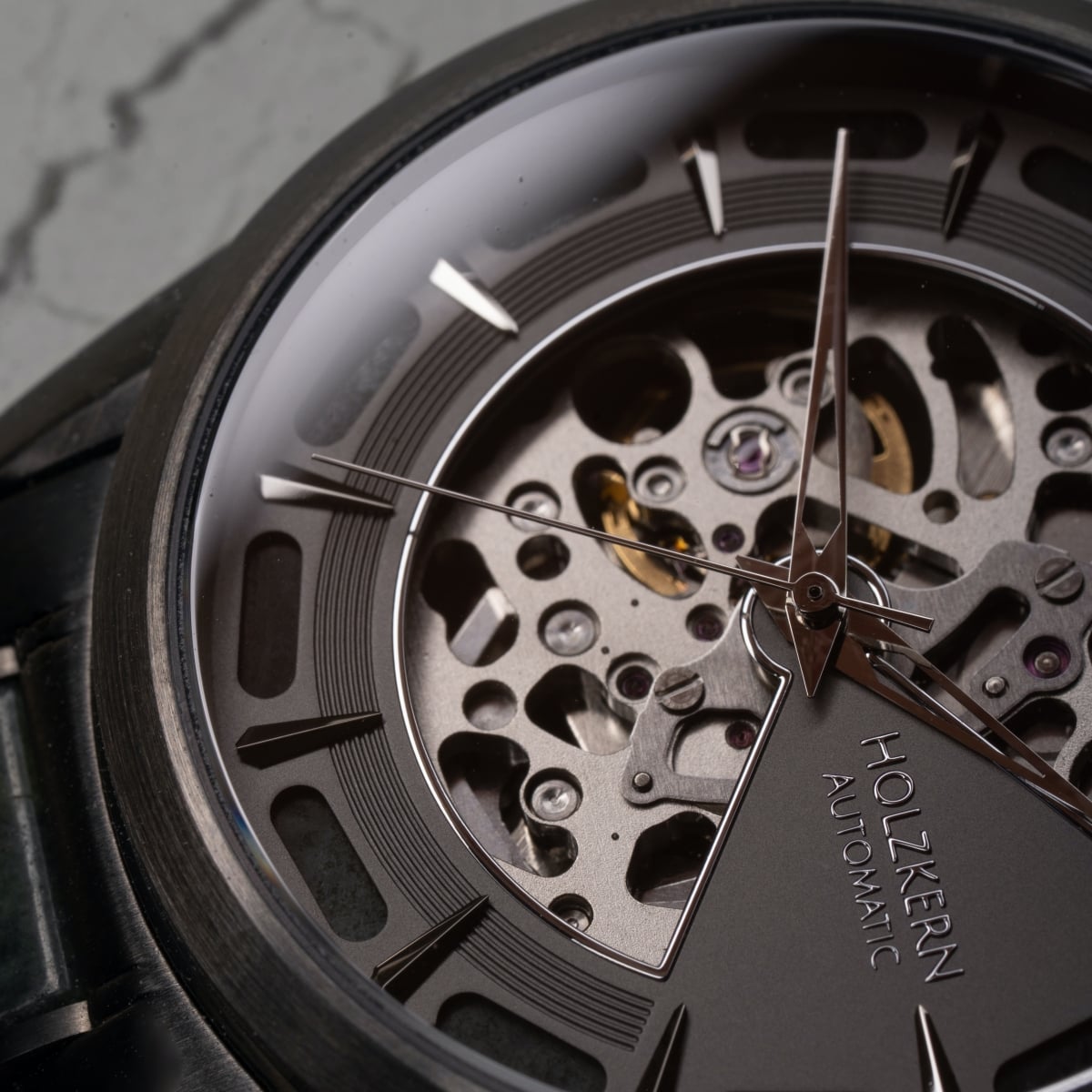 "Acraman" watch with marble and dark grey details, showcasing a sleek and modern design.
