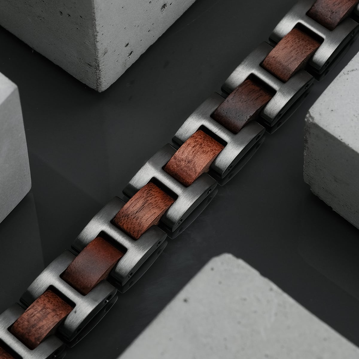 "Acoustic" bracelet featuring walnut and grey elements in a sleek, modern design.