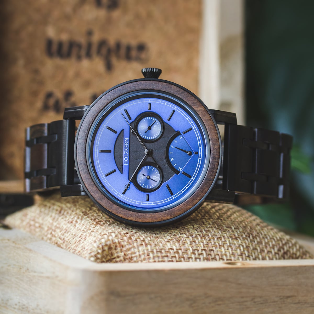 "Belize" watch, featuring a blue dial and stylish leadwood accents.