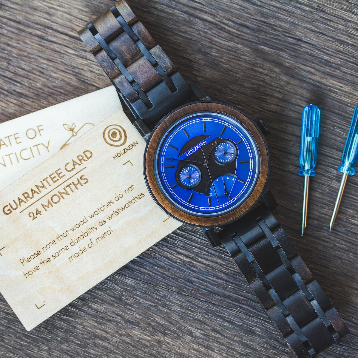 "Belize" wooden watch with blue dial, featuring a rustic leadwood design.