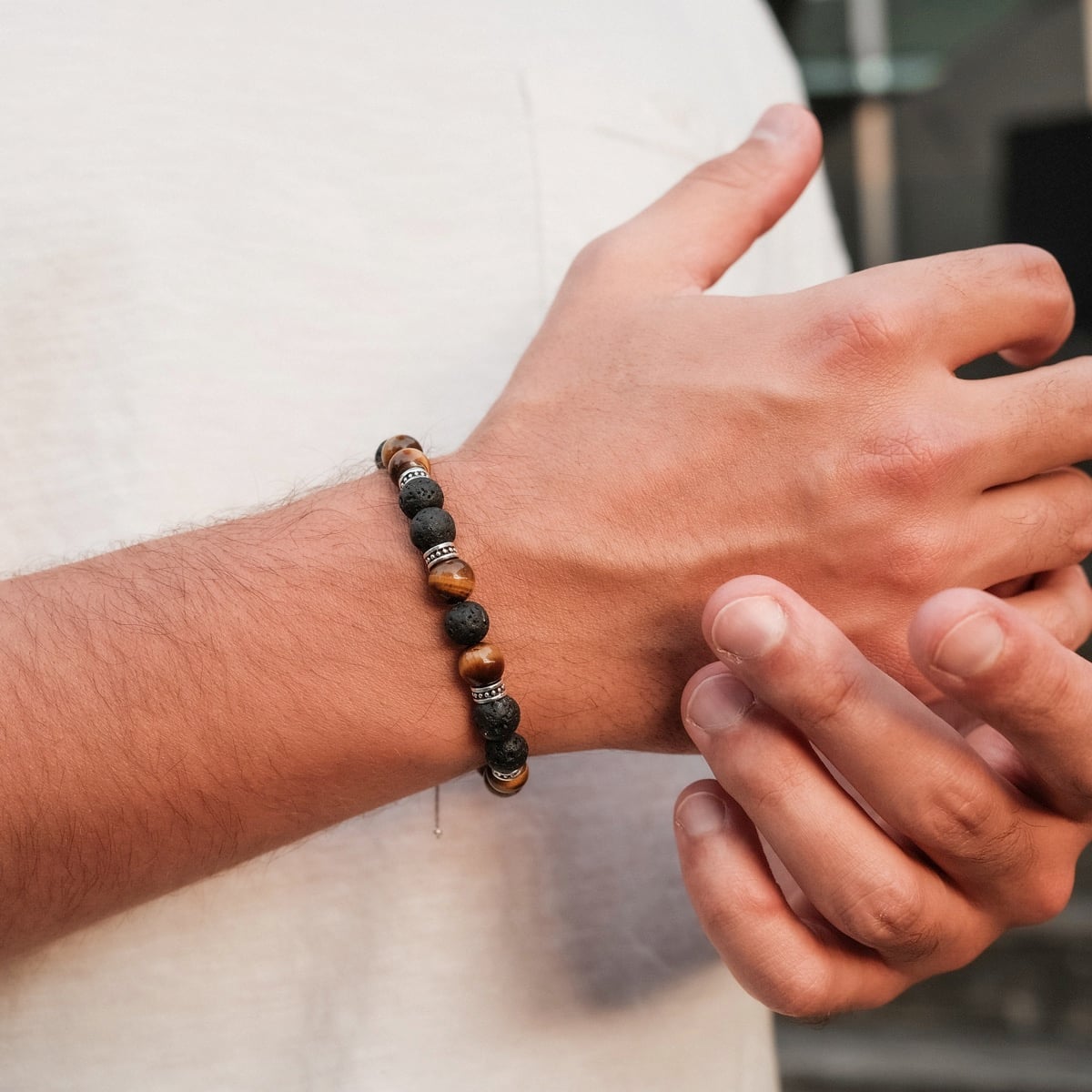 "Superset" bracelet featuring tiger eye and lava stones with a stylish, natural look.