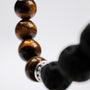 Bracciale "Superset" con pietre Tiger Eye e Lava in un design elegante e terroso.