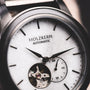 Orologio "Manhattan", con un design in acero e marmo con un'estetica elegante e moderna.