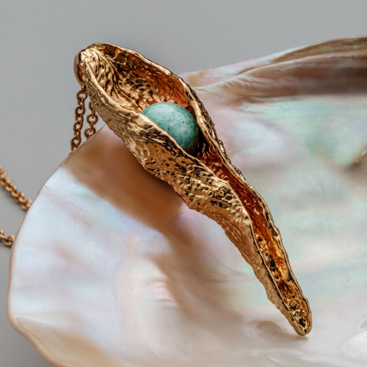 "Chalice Necklace" necklace featuring amazonite and gold, with an elegant, textured design.