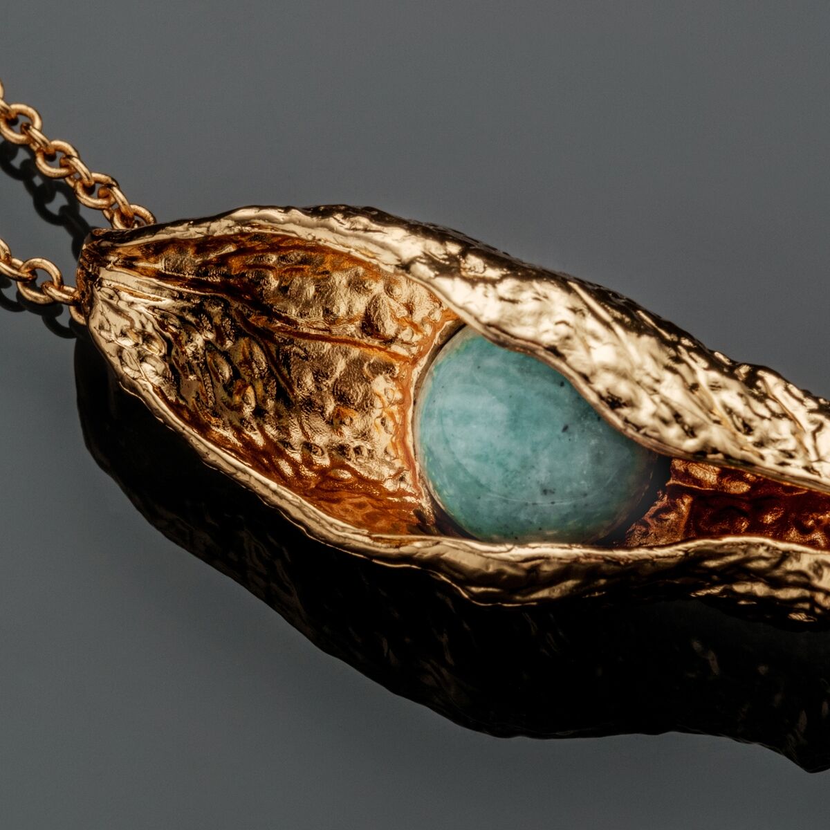"Chalice Necklace" necklace, featuring an elegant mix of amazonite and gold with a rustic, textured design.