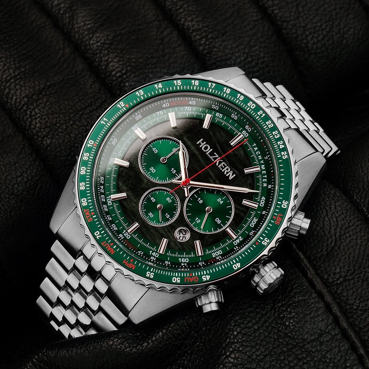 "Openhorizon" watch in green marble and silver with a sleek, modern design on a textured background.