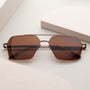 "The Visionary", occhiali da sole in noce e bronzo con un design elegante e moderno.