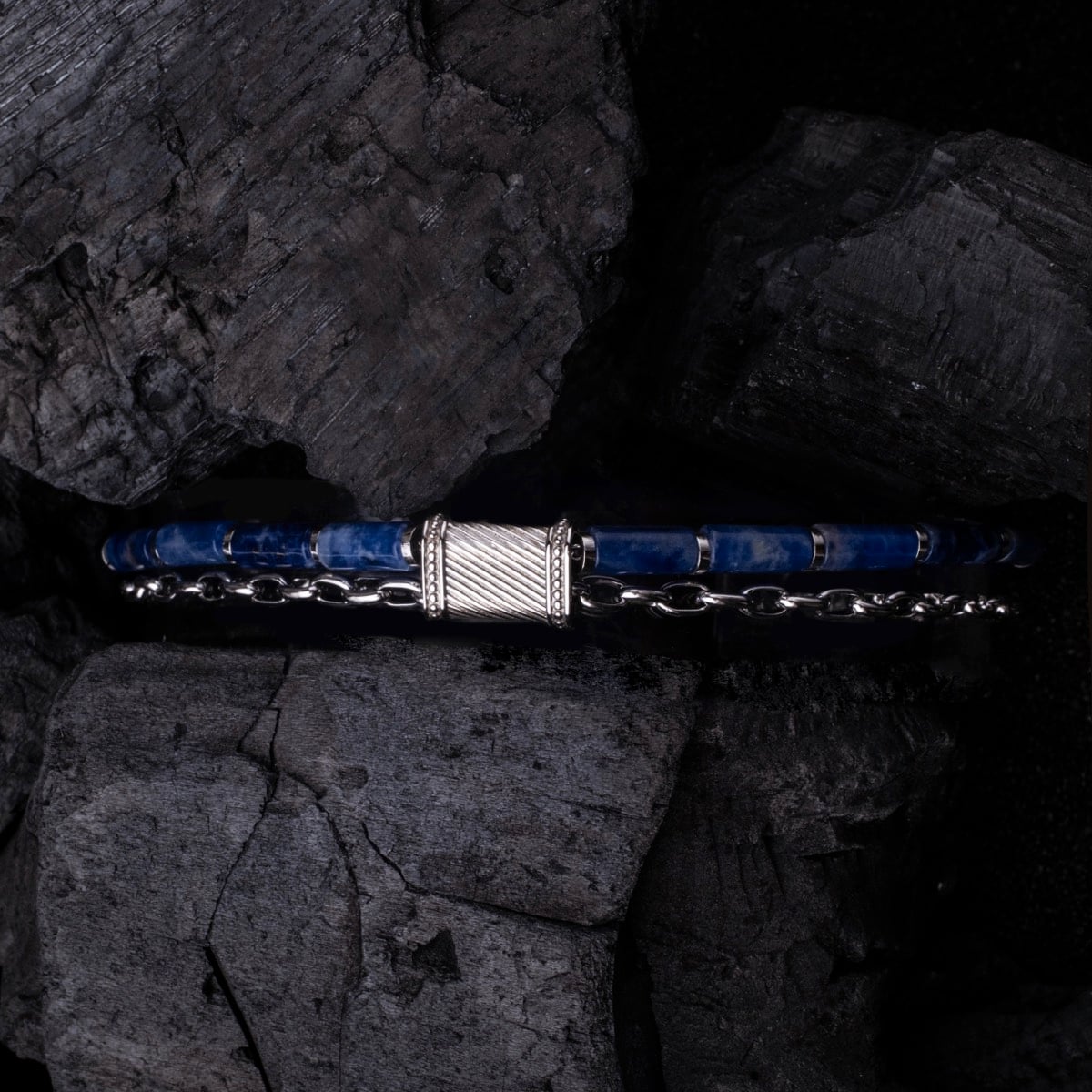 "Supersonic" bracelet featuring a marble and silver design, with a sleek and modern aesthetic against a textured backdrop.