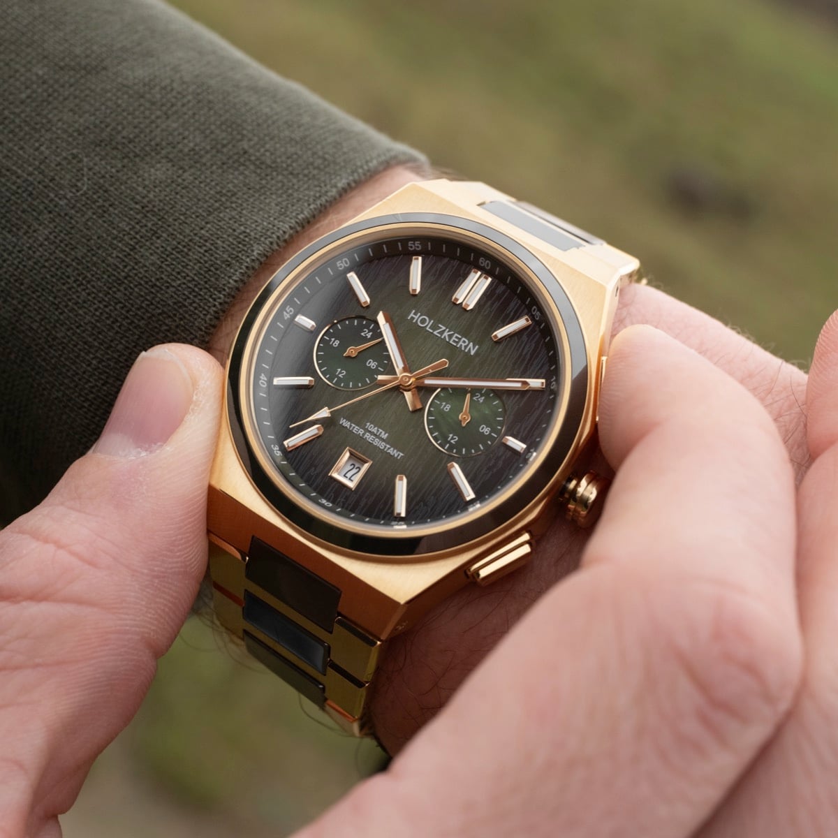 "Oceanswell" watch features a sleek ceramic and gold design, with an elegant, sophisticated dial style.