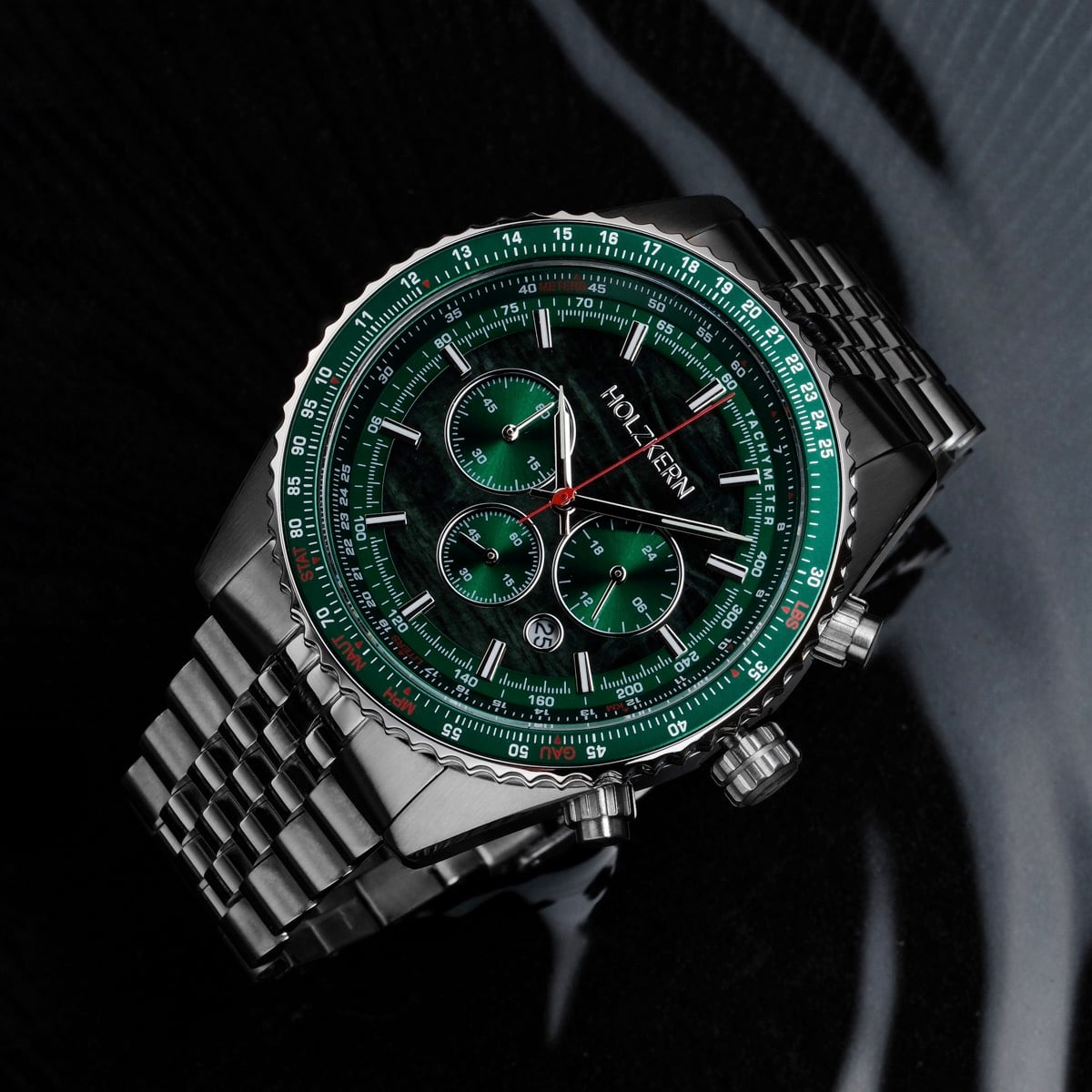 "Openhorizon" watch features a green marble face and a sleek silver design.