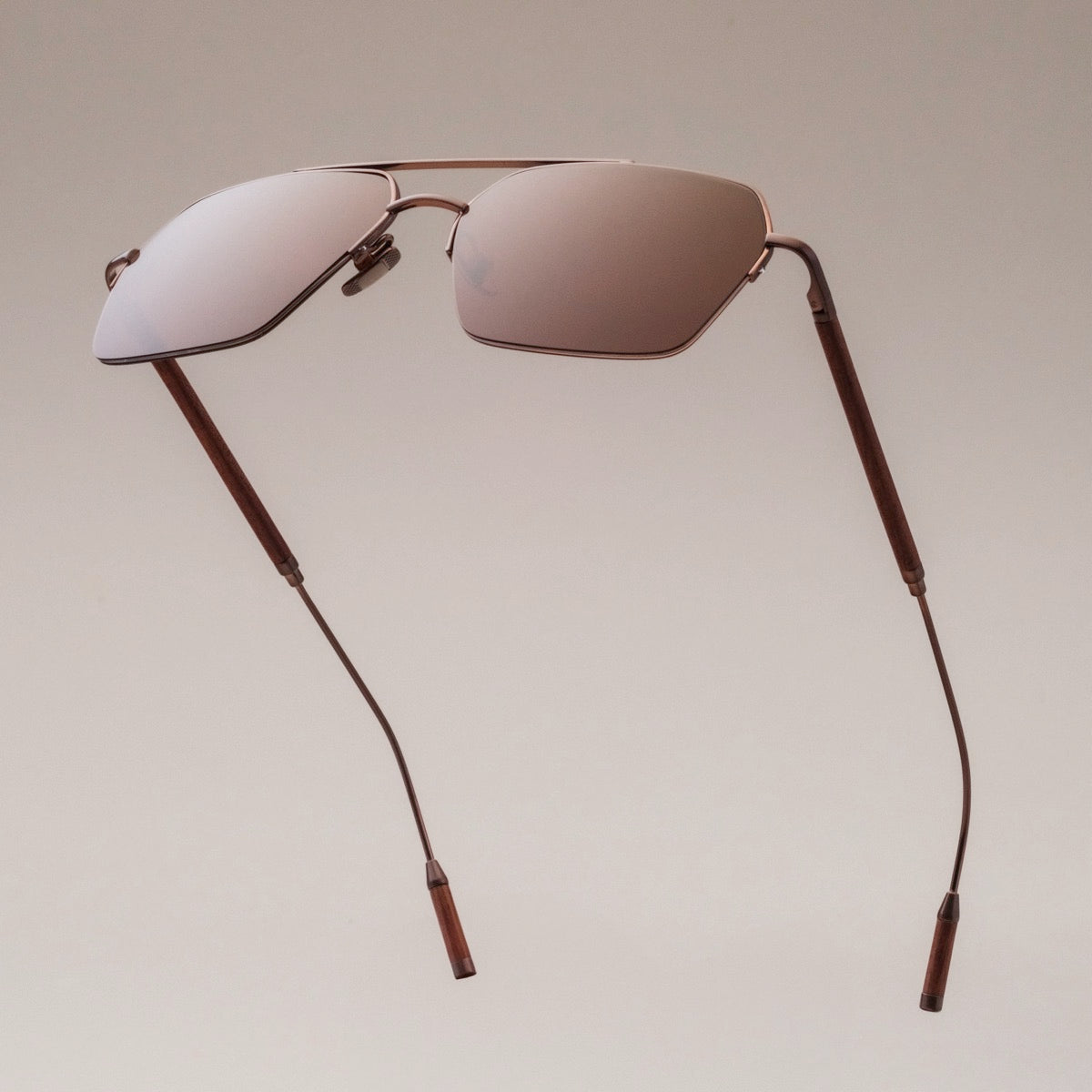 "The Visionary", stylish sunglasses featuring walnut and bronze design elements.