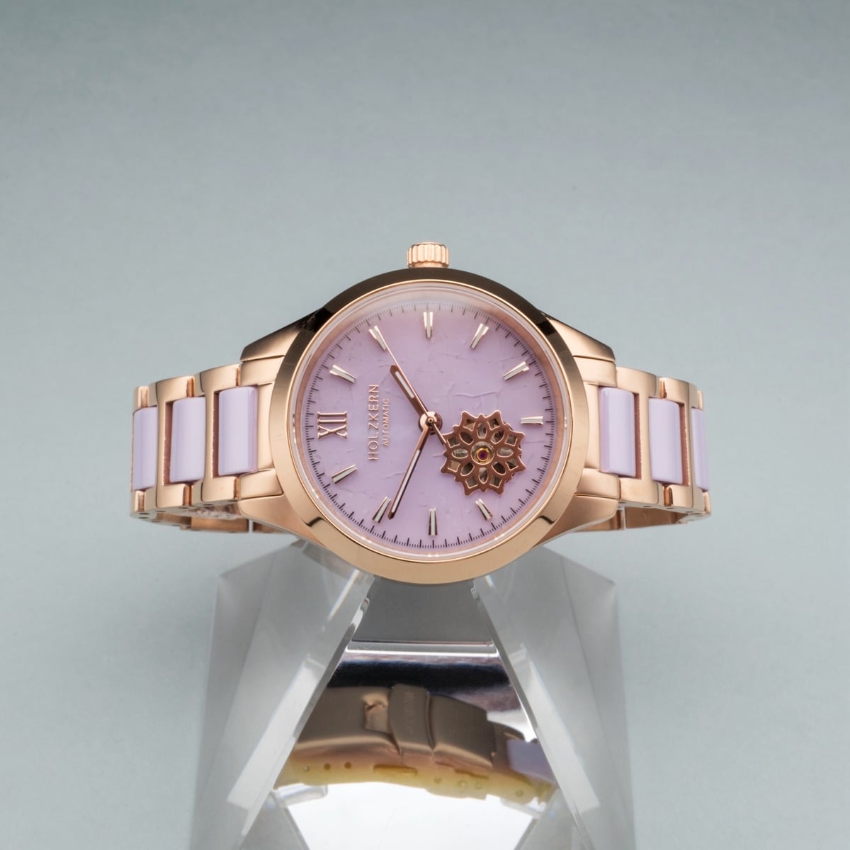 Orologio "Kaleidoscopic" con un bracciale in oro rosa e ceramica con un quadrante ametista e design intricato.