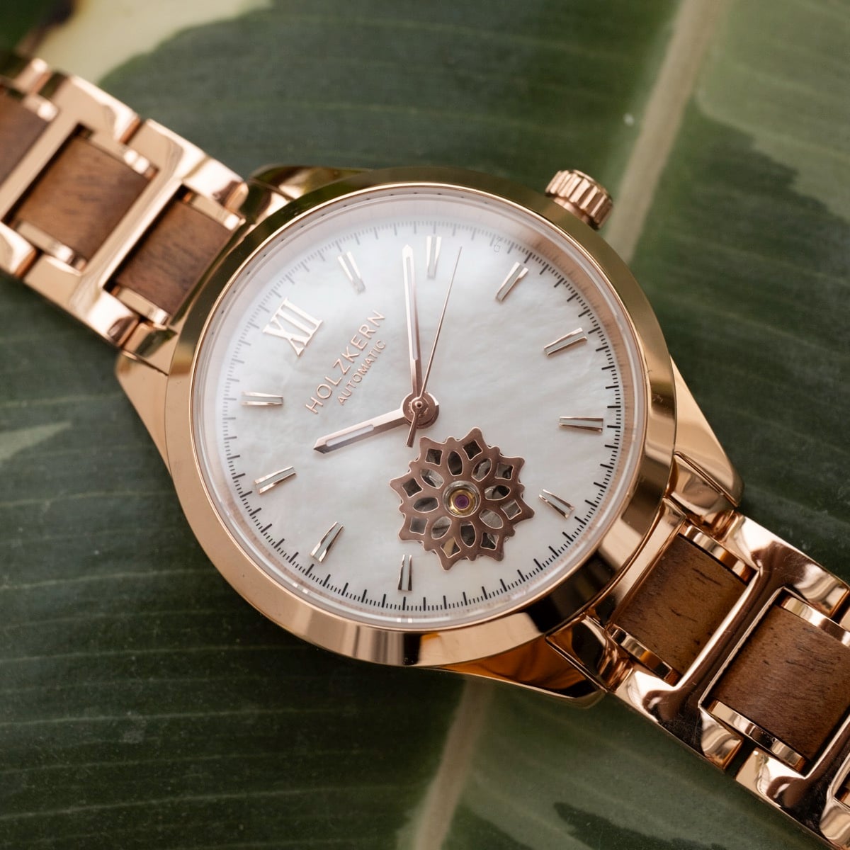 "Kaleidoscopic" wristwatch featuring a nacre dial and koa wood accents with a kaleidoscopic design.