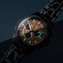 "Genevra watch featuring burl wood/maple accents and a sleek, modern design with a dark and elegant aesthetic."
