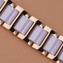 Bracciale "Kaleidoscopic" con accenti ametista e ceramica, che mostra uno stile elegante e moderno.