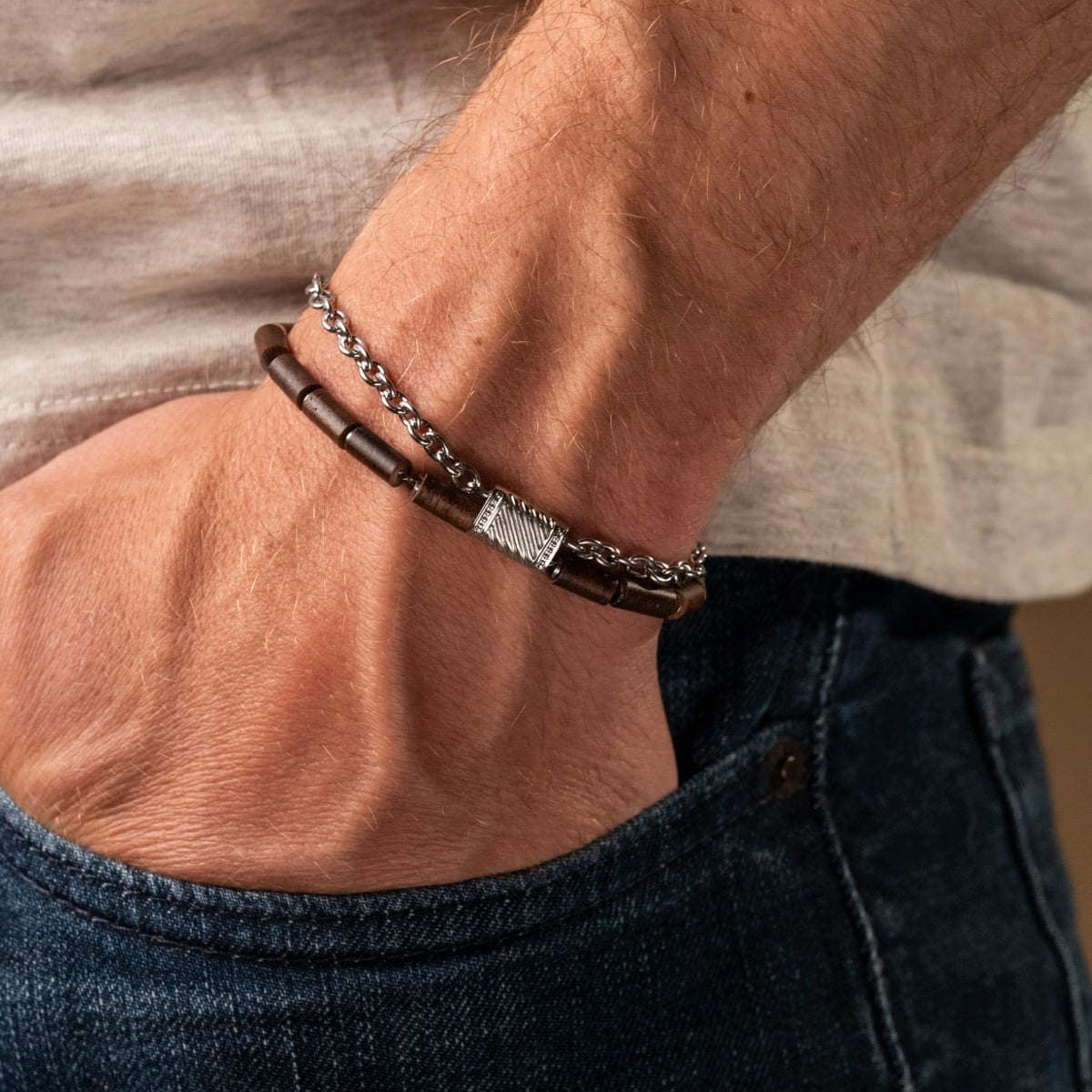 "Supersonic" bracelet in walnut and silver, featuring a sleek and stylish design on the wrist.