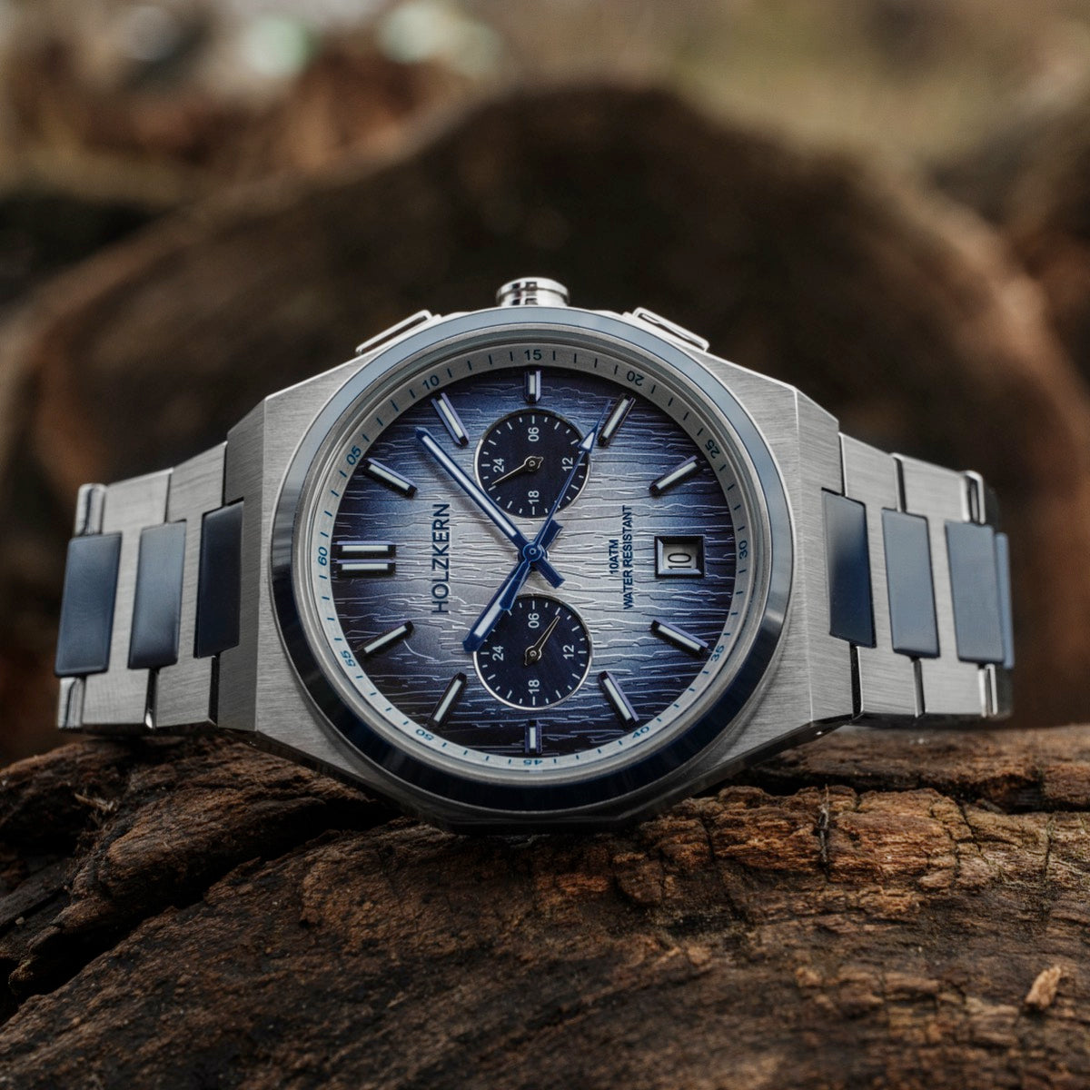 "Oceanswell" watch featuring a ceramic and silver design with a sleek blue dial.