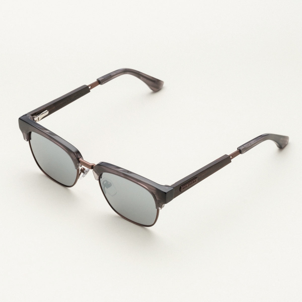 "The Virtuoso" sunglasses feature a sleek, modern style with Leadwood and Ash frame accents.