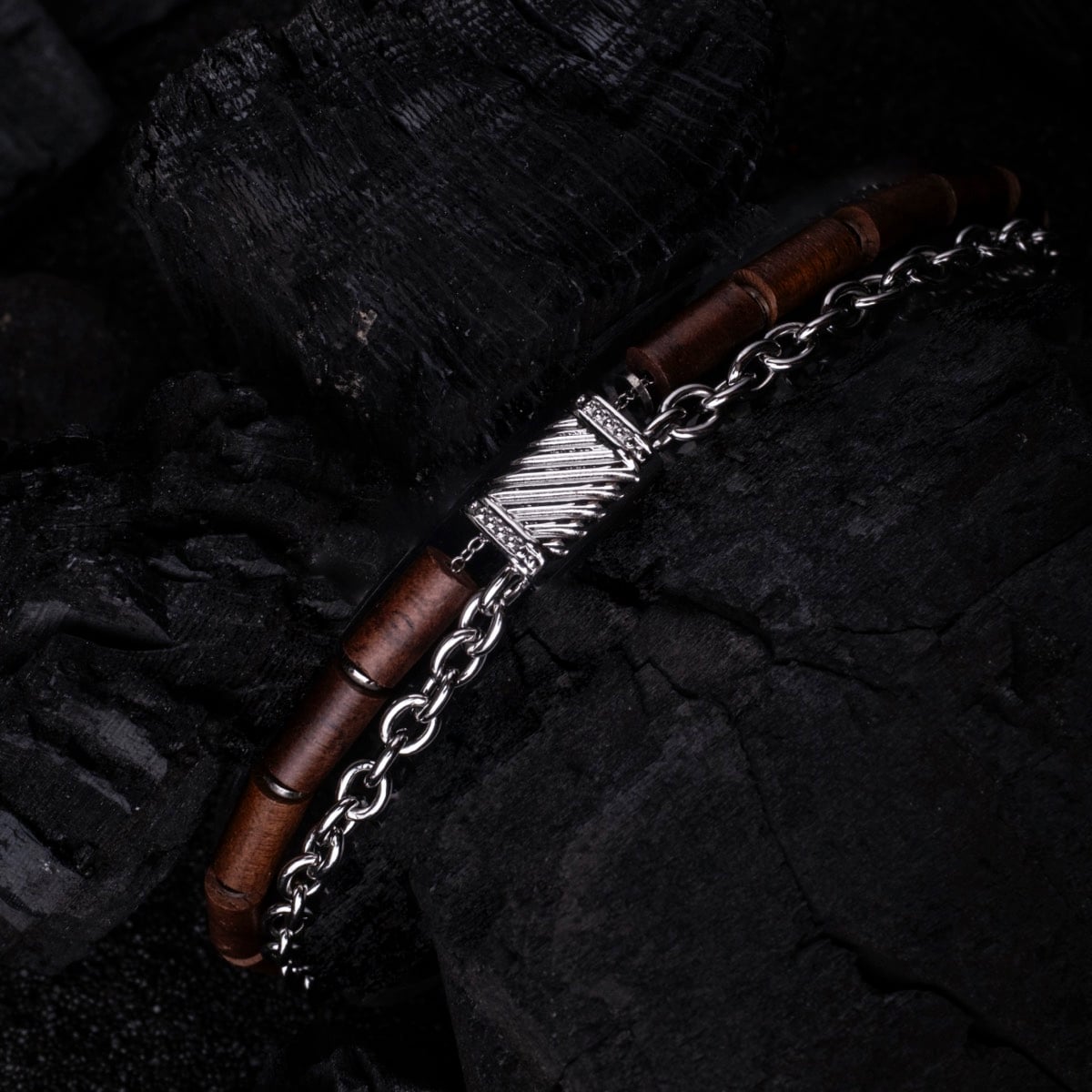 "Supersonic" bracelet in walnut and silver, featuring a sleek and modern design.