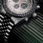Orologio "Openhorizon" con faccia in marmo grigio e accenti in argento, con un design cronografo dettagliato.