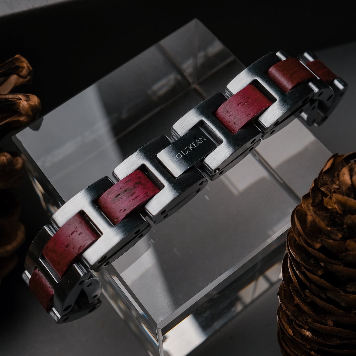 "Acoustic" bracelet featuring an amaranth and silver design with a modern, geometric style.
