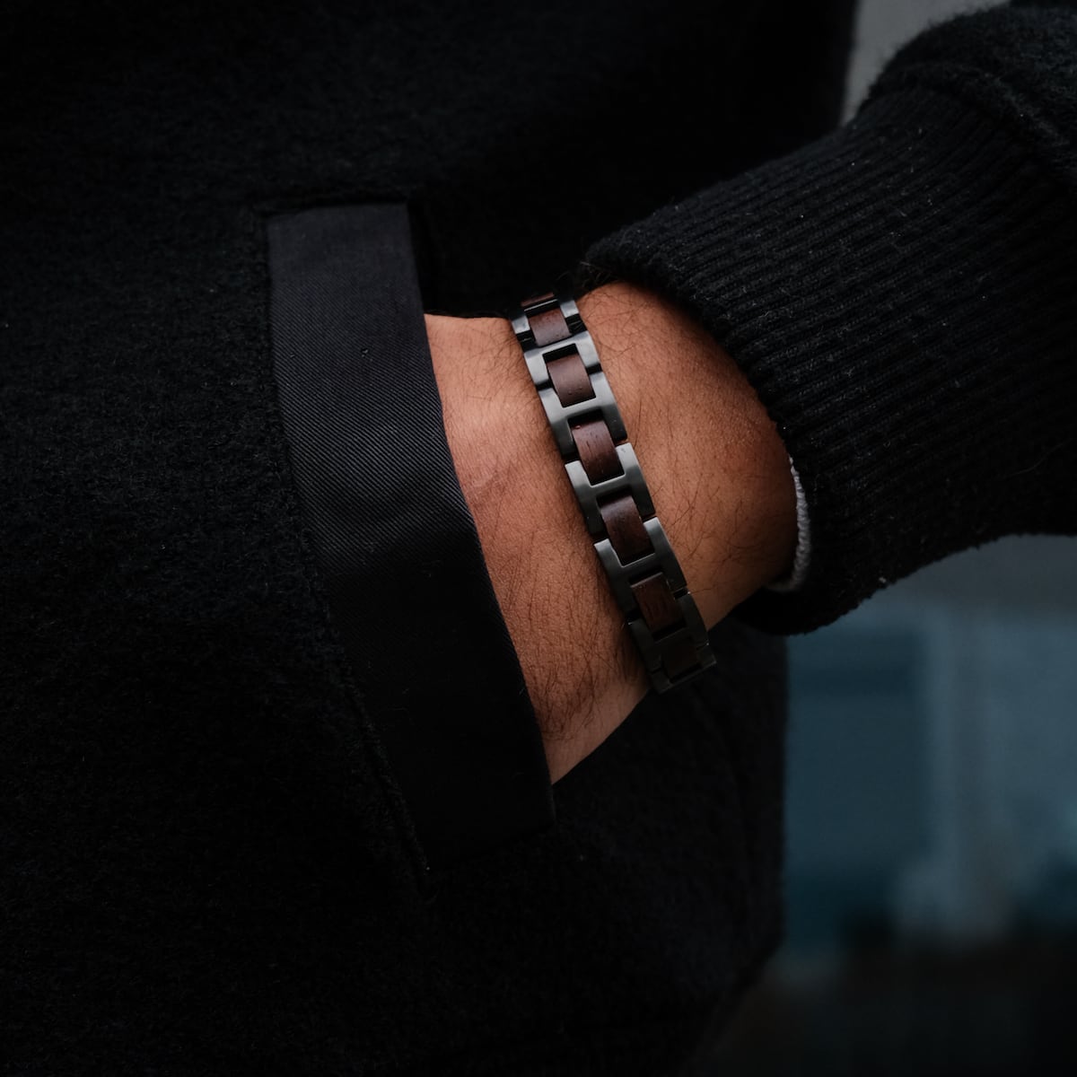 "Acoustic" bracelet featuring walnut and grey materials, offering a sleek and modern style.