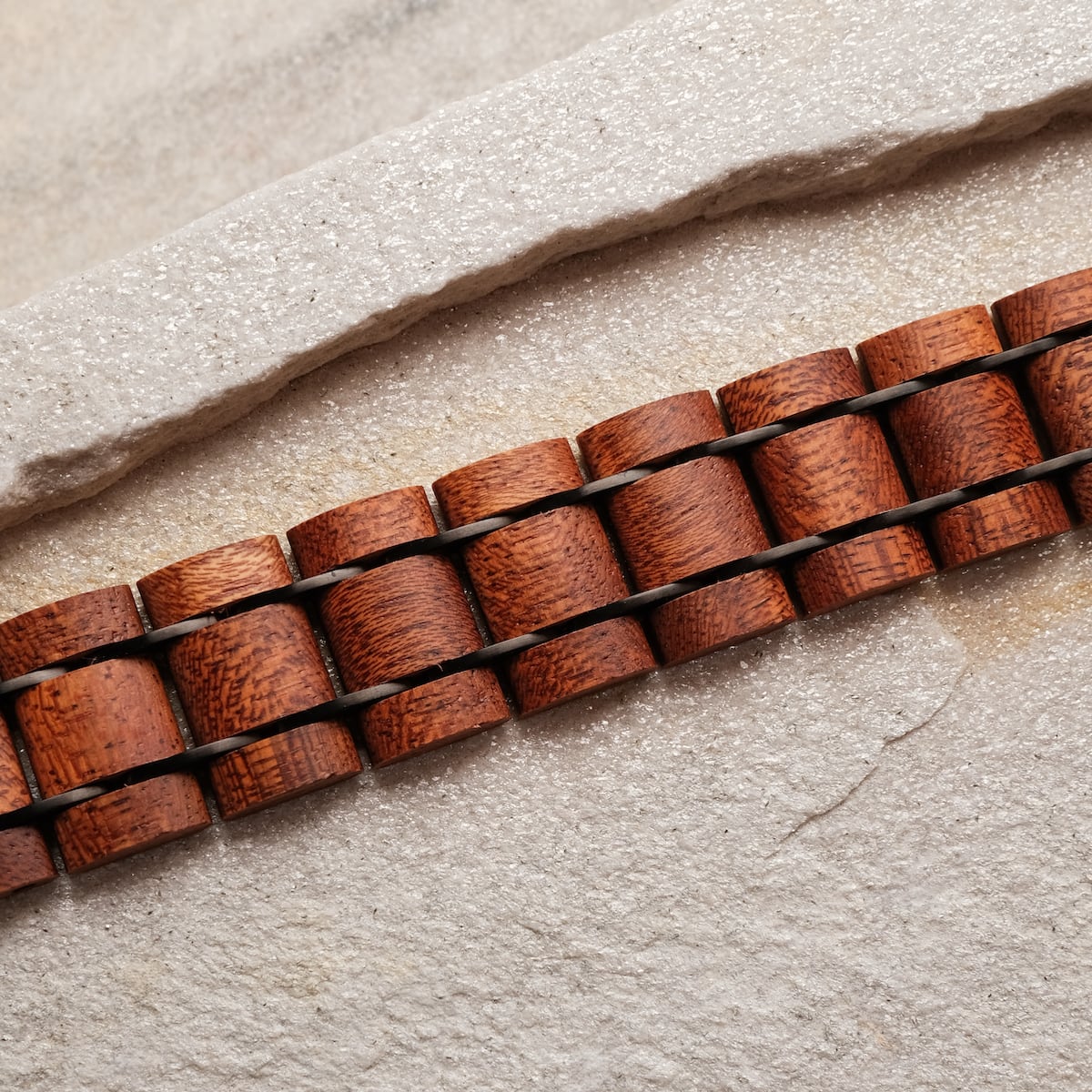 "Grandezza bracelet featuring a mahogany and gray design with a textured, natural look."