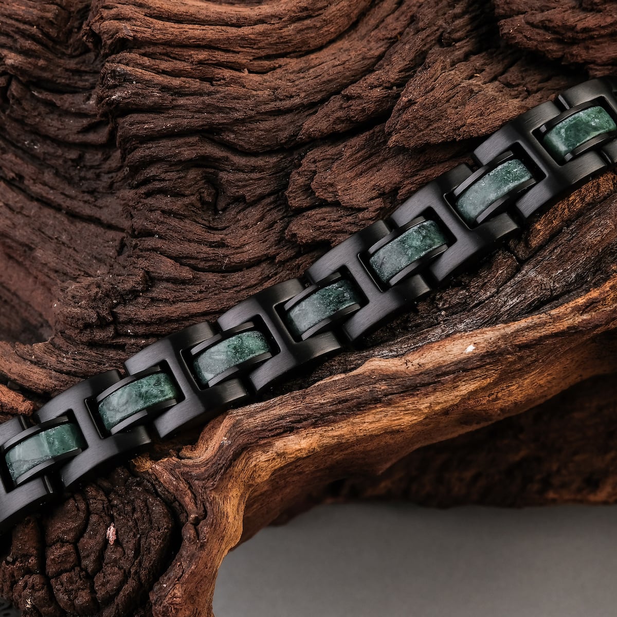 "Forte" bracelet featuring a marble and black design, elegantly displayed on a rustic wood background.