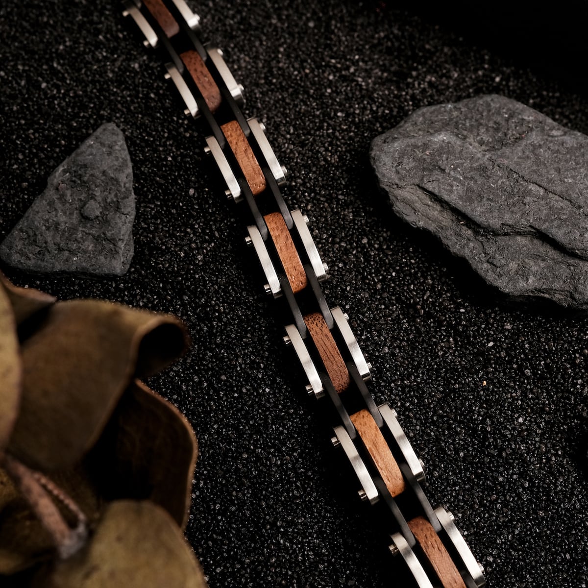 "Allegro" bracelet in walnut and silver, showcasing a sleek and modern style.