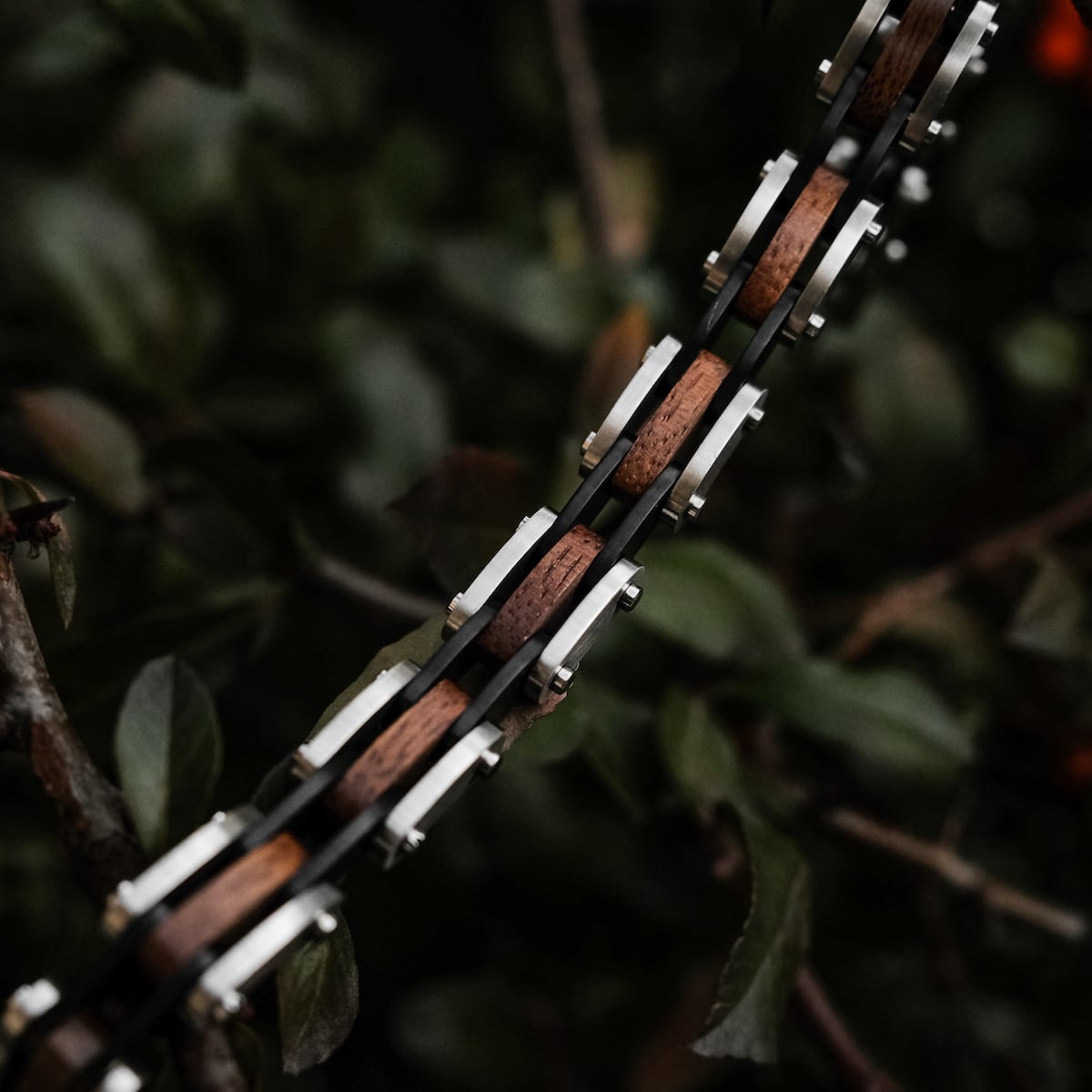 "Allegro" watch strap in walnut and silver, featuring a sleek and modern design with natural wood elements.